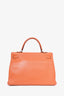 Hermès 2010 Orange Clemence Leather Kelly Retourne 35 Top Handle with Canvas Strap