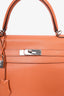 Hermès 2010 Orange Clemence Leather Kelly Retourne 35 Top Handle with Canvas Strap